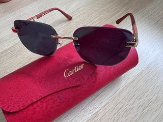 Gafas de sol Cartier doradas y rojas