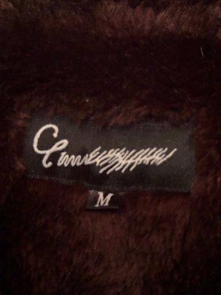 Chaquetón negro con detalles marrones