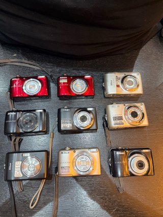 Lotto 9 Fotocamere Nikon Coolpix per pezzi ricambi