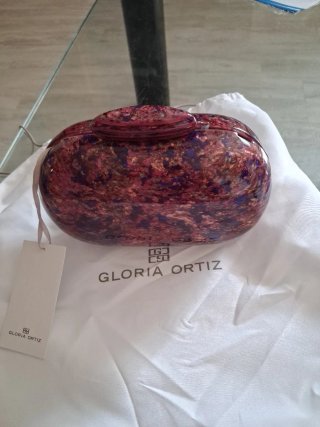 Bolso de mano rígido dorado y morado
