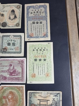 Lote 14 billetes y bonos japoneses históricos