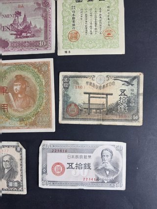 Lote 14 billetes y bonos japoneses históricos