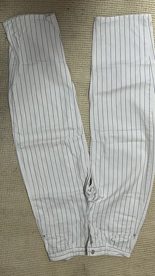 Jeans bianchi con righe blu