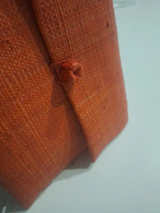 Cartera de mano coral tomado