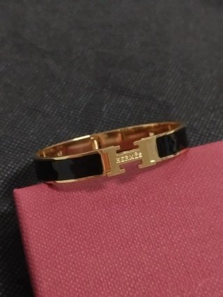 Pulsera Hermès H Negra y Dorada