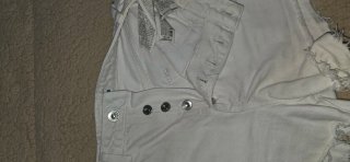 Pantalones cortos blancos rasgados T. XS