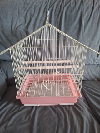 Jaula para pájaros blanca y rosa