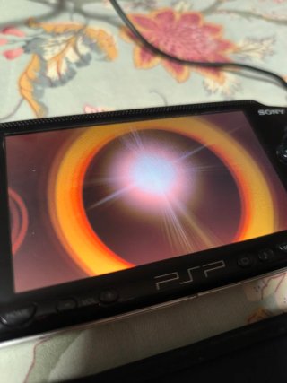 Sony PSP-1004 Negra + Cargador y Funda