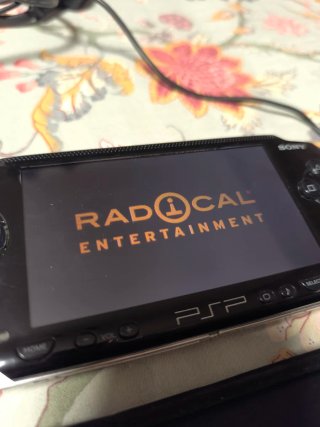 Sony PSP-1004 Negra + Cargador y Funda