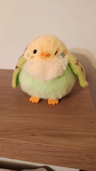 Peluche periquito en nido