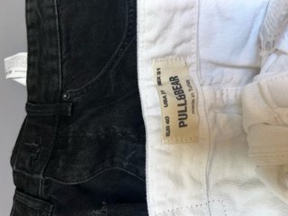 Pantalones cortos rotos negros y blancos