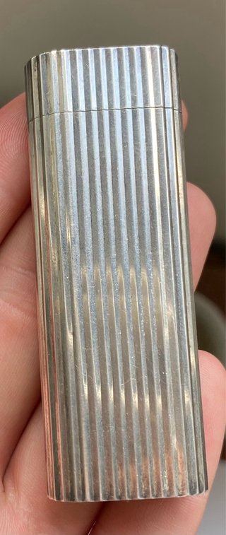 Mechero Cartier Godron chapado en plata. 1970.