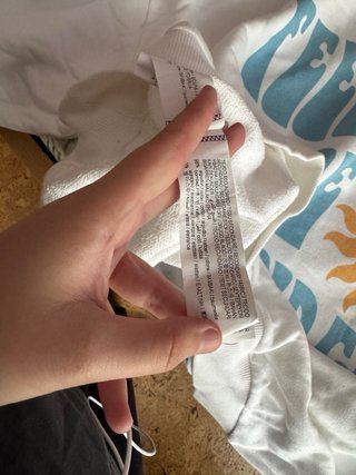 Sudadera blanca con sol sonriente
