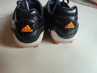 Botas de fútbol de niño Adidas negro y naranja