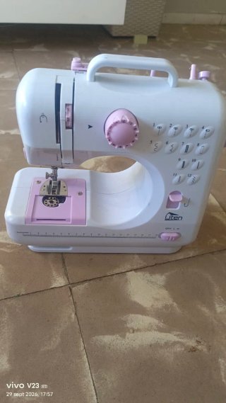 Máquina de coser Uten