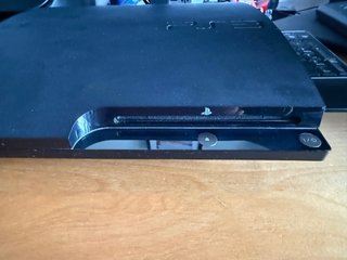 Consola PlayStation 3 (PS3) con mando y juegos