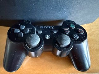 Consola PlayStation 3 (PS3) con mando y juegos
