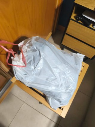 Bolsa con ropa variada talla L