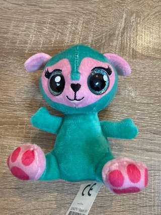 Peluche mono verde y rosa ojos grandes
