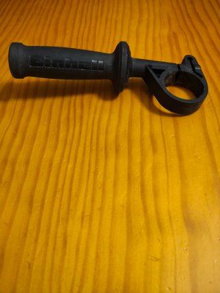 Mango auxiliar para taladro percutor