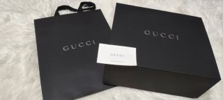 Caja y bolsa Gucci