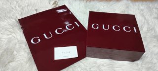 Caja y bolsa Gucci