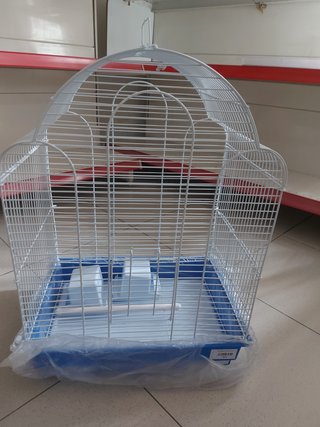 Jaula para pájaros blanca y azul