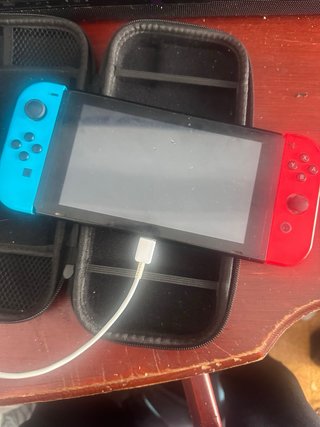 Nintendo Switch Azul y Rojo negocio y entercambio