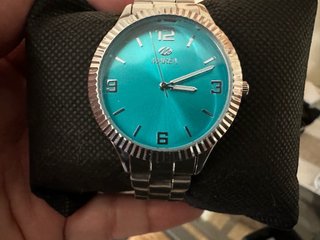 Reloj Marea Turquesa y Plateado