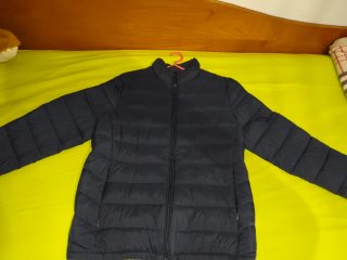 Plumífero azul marino nuevo
