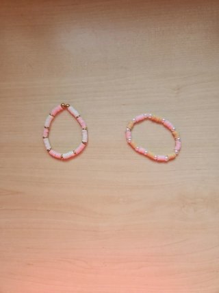 2 Pulseras Elásticas Tonos Rosas y Claros