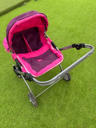 Carro de muñecas rosa y morado