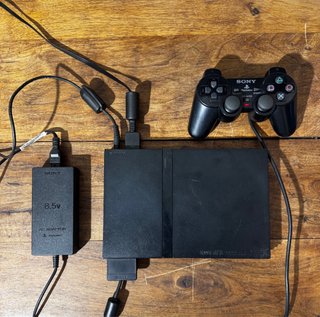 PS2 Slim Negra + Mando + Tarjeta Memoria