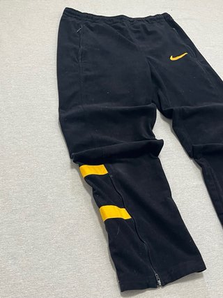 Pantalón de chándal NIKE negro y amarillo
