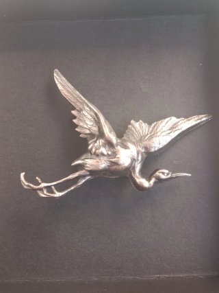 Broche de ave plateado