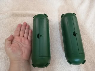 Protector enchufe exterior verde.