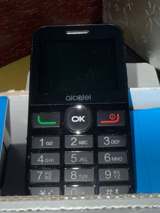 Teléfono Alcatel con base de carga