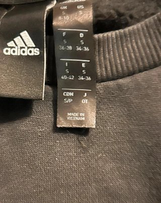 Sudadera Adidas original de color negro, con el ic