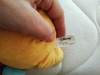 Peluche Winnie the Pooh con cestino