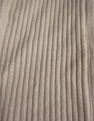 Jersey de punto beige con cremallera