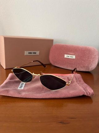 Gafas de sol Miu Miu doradas