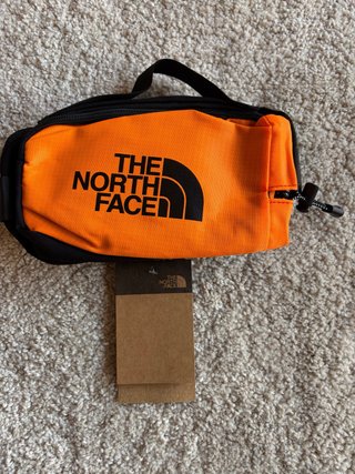 Riñonera The North Face Naranja y Negra