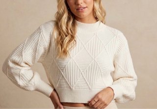 Maglione bianco a trama geometrica