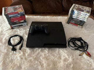 PS3 slim + mando original + 22 juegos