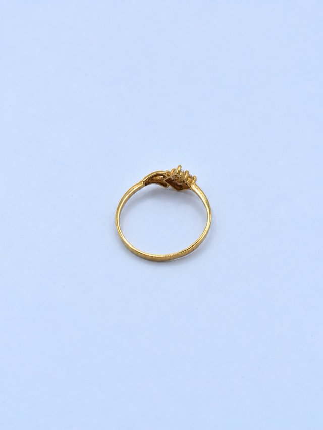 Anillo de Oro 18k con Flor de Circonitas