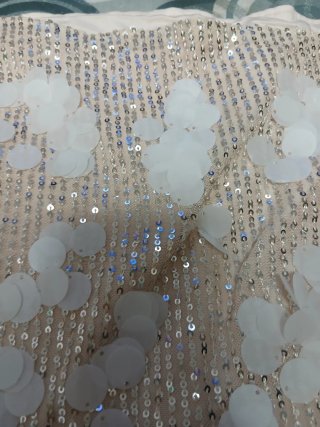 Salopette corta beige con aplicaciones