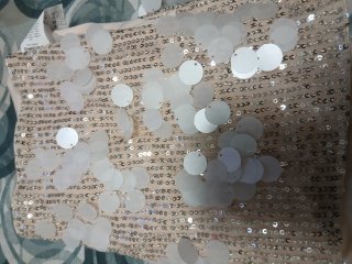 Salopette corta beige con aplicaciones