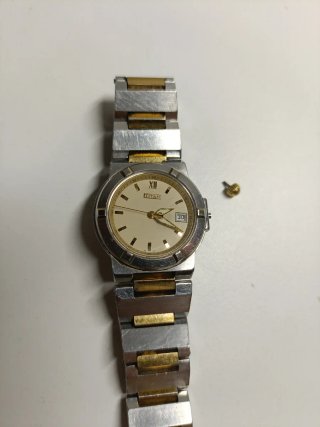 Reloj Titan Oro y Plata