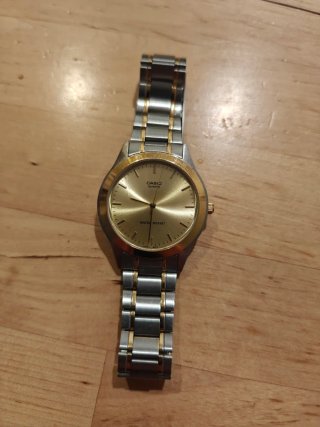 Reloj Casio MTP-1128 Dorado y Plateado