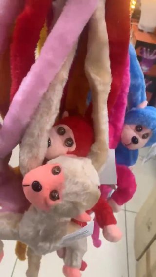 Peluche scimmietta braccia lunghe